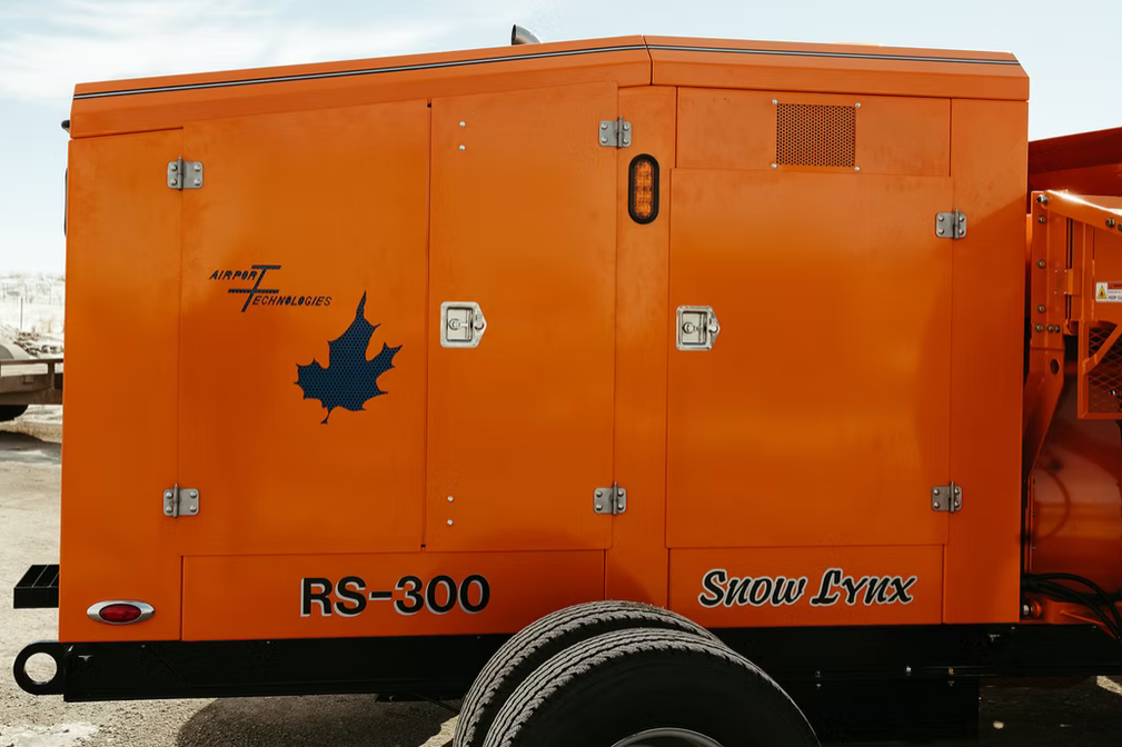 Snow Lynx branding detail on orange chassis panel