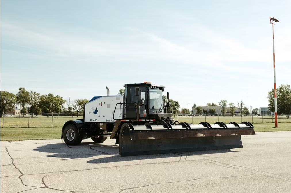 Snow Mauler PV-400 wide side view with full plow extended