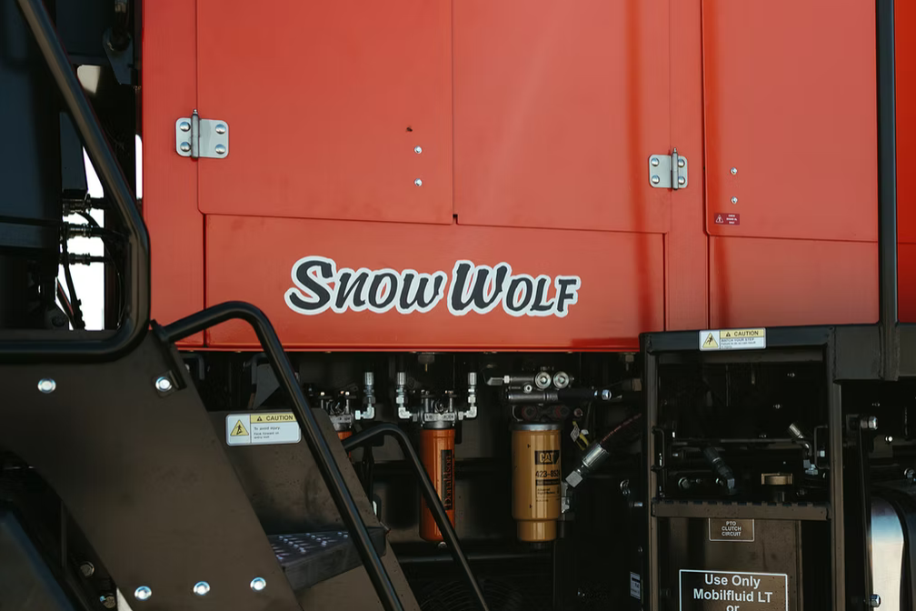 Snow Wolf branding detail on red chassis panel